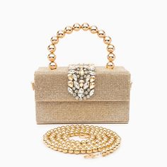 Gold Luxury Top Handle Box Bag Fashion Accessory, Luxury Square Clutch With Detachable Handle, Luxury Bags With Pearl Handle, Luxury Bag With Pearl Handle, Rectangular Shape, Luxury Rectangular Bag With Pearl Handle, Gold Rhinestone Clutch Fashion Accessory, Glamorous Handheld Clutch, Luxury Gold Square Clutch, Party Shoulder Bag With Rhinestones, Rectangular