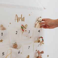 someone is placing stuffed animals on the calendar