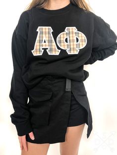 8.0 oz., 50% cotton / 50% polyester pre-shrunk fleece knit. Letters are embroidered. Black College Sweatshirt With Embroidered Graphics, Black Embroidered Sweatshirt For College, Black Casual Sweatshirt With Letter Embroidery, Black Long Sleeve Sweatshirt With Letter Embroidery, Sporty Black Embroidered Sweatshirt, Fall Streetwear Sweater With Letter Embroidery, Black Cotton Sweater With Letter Embroidery, Embroidered Long Sleeve Sweater For College, Embroidered Long Sleeve College Sweater