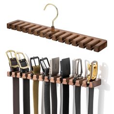 a rack with several belts hanging from it