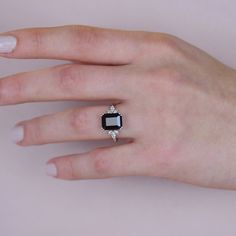 14K Gold  Black Onyx Ring, Emerald Cut Engagement Ring, Black Onyx Square Ring, Black Promise Ring, Gift For Her, Mothers Day Gift Item Main Gemstone: AAA Grade Onyx Cubic Zirconia Side Gemstone: AAA Grade White Cubic Zirconia  Size: 10*8 - 4*2 - 2*1 Color: Black Shape: Emerald and Marquise Average Quality: AAA+ 🎉All of gold options of the product are produced from solid gold. 🎉While using the product, it's healthier to avoid touching the cream and similar products in terms of cleaning the product. 🎉Items are shown larger in pictures to show details-please note the dimensions. Package 🎀 All of these products are sent carefully packed in elegant jewelry boxes. 🎁 How to order 🤳🏼 🎉First step: Click on the product. 🎉Second Step: Select the material. 🎉Third Step: Select the ring size. Classic Black Rings With Accent Stones, Classic Black Jewelry With Accent Stones, Black Ring With Accent Stones, Classic Black Jewelry With Center Stone, Classic Black Sapphire Ring For Gift, Classic Black Sapphire Ring As Gift, Black Spinel Sapphire Ring Gift, Black Jewelry Ring With Accent Stones, Black Promise Ring With Accent Stones