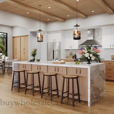 a large kitchen with an island and bar stools