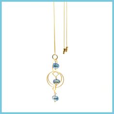 This beautiful necklace has various-sized rings made of matte gold-tone metal enhanced with three translucent glass beads. It comes on a gold-tone snake chain with a pull feature that allows it to be worn at any length, so whatever you're wearing - it will always look perfect. Pendant is 3.5" long and 1" wide. Chain can be adjusted up to 32" long. Choose from a topaz gray or blue glass bead accent. Made by John Michael Richardson Translucent Glass, Beautiful Necklace, Blue Beads, Matte Gold, Snake Chain, Glass Bead, Gold Tone Metal, Blue Glass, Beautiful Necklaces