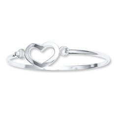 A romantic heart embellishes this sterling silver bangle bracelet for her. Elegant Promise Bracelets With Heart Charm, Elegant Bracelets With Heart Charm For Promise, Elegant Adjustable Open Heart Jewelry, Elegant Adjustable Open Heart Bracelet, Silver Heart Charm Bracelet For Promise, Silver Bangle Jewelry For Promise, Dainty Heart Bracelet For Promise, Silver Bangle Bracelets For Promise, Classic Heart-shaped Sterling Silver Bracelet