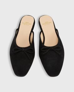 The flat mule: not quite as sweet as a ballerina, not quite as masculine as a loafer, with the practicality of both. And you can just slide it on! This pair is made in Italy with a tapered, almond-shaped toe box and a demure little bow. And the higher vamp — no toe cleavage here — gives a little more coverage. (Read: minimal clacking.) Elegant and casual at the same time. Flat Mules, Shoes Flats Sandals, Clothing Catalog, Buckle Shoes, Scarf Jewelry, Heeled Loafers, Sneaker Heels, Rubber Heels, Shoe Collection