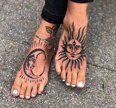 a woman's feet with sun and moon tattoos on their ankles, while standing in the street