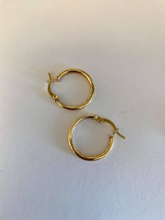 SOLID 14K Yellow Gold Hoop Earrings - Made to last a lifetime! Measurements : Diameter 20 mm Thickness 2 mm Weight about 1.5 grams Sold as a pair. The Earrings will be sent gift-wrapped and packed in a padded envelope to maintain the product Our jewelry are water resistant and comes with 1 year warranty Thank you for your interest. Please check out our other items and be sure to add us to your favorites! https://www.etsy.com/shop/Limajewelry We look forward to the opportunity of serving you. Polished Finish Hoop Huggie Earrings As Gift, Small Hoop Yellow Gold Earrings, Small Polished Hoop Earrings As A Gift, Small Hoop Earrings With Polished Finish As Gift, Everyday Hallmarked Hoop Huggie Earrings, Everyday Hallmarked Huggie Hoop Earrings, Minimalist Small Hoop Hallmarked Earrings, Tarnish Resistant Yellow Gold Hoop Earrings, Vintage Gold-plated Hoop Earrings For Gift