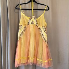 This Paneled Dress (Or Top) Is Something Out Of A Fairytale. It Has A Yellow Slip Underneath With A Pink Lemonade Mesh On Top. Patterned Details (See Photo) With Beading And Floral Fabric On Front. Ties Around The Neck. Very Short! Could Be Worn As Nightgown, Or Even A Top. Yellow Summer Sleep Dress, Spring Party Lace Nightgown, Fitted Nightgown For Summer Parties, Fitted Summer Nightgown For Party, Yellow Lace Mini Dress For Summer, Bohemian Lace Trim Summer Nightgown, Bohemian Summer Nightgown With Lace Trim, Bohemian Yellow Mini Dress For Party, Yellow Summer Nightgown For Sleep