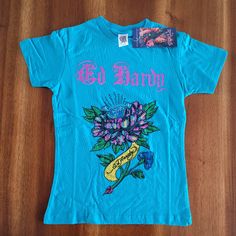 Ed Hardy By Christian Audigier Kids Graphic Tee. Girls Cut Tee. Teal Color With Iconic Design & Rhinestones! 100% Cotton. S = 2/4 Style 5gg204tflg Ed Hardy Shirt, Hardy Shirts, Ed Hardy Designs, Girls Cuts, Cut Tees, Christian Audigier, Vintage Boys, Kids Graphic Tees, Vintage Tattoo