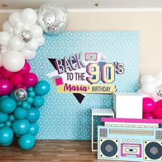 a party scene with balloons, boombox and radio on the floor for an 80's themed birthday