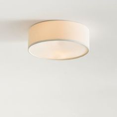 a white ceiling light with a round shade on the top and bottom part of it