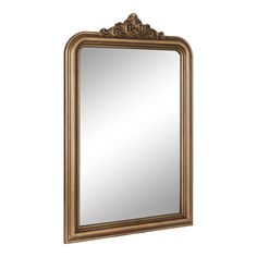 a gold framed mirror on a white wall