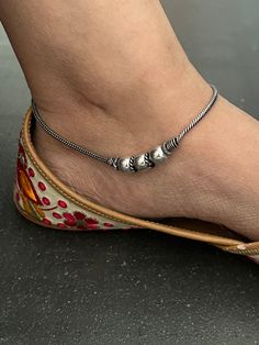 A beautiful pair of anklets handcrafted in brass and antique polish. Hook Closure  Weight: 30 grams per pair  Length of Anklets: 10 inches. Handmade Adjustable Anklets, Adjustable Metal Anklet For Festive Occasion, Adjustable Metal Anklets For Festivals, Festive Metal Anklet With Silver Beads, Adjustable Traditional Anklets For Puja, Traditional Anklets For Puja, Festive Metal Anklets, Festive Bohemian Metal Anklets, Metal Anklets With Silver Beads For Festivals