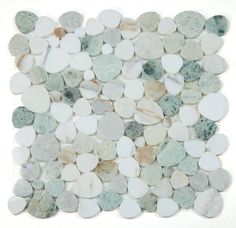 a pile of white and green pebbles on top of each other