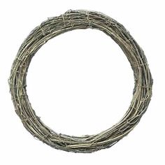 a round wreath made out of branches on a white background