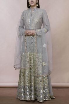 Grey floor-length anarkali with all over mirror embroidery. Comes with matching dupatta.
Components:2
Mirror embroidered
Neckline:Mandarin collar
Sleeve Length:Full
Fabric:Georgette
Color:Grey
Split neckline
Embroidered dupatta with lace - Aza Fashions Lehenga Bollywood, Anarkali With Dupatta, Silk Anarkali Suits, Floor Length Anarkali, Embroidered Anarkali, Lehenga Wedding, Lehenga Collection, Embroidered Neckline, Designer Dress