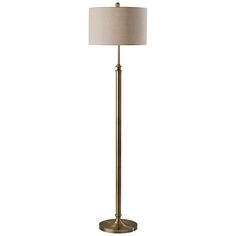 a floor lamp with a beige shade on top and a white linen shade on the bottom