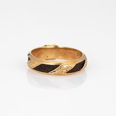 Finely detailed antique Victorian ring (circa 1880s to 1900s), crafted in 18 karat yellow gold.    In the Victorian era, hair jewelry held immense sentimental value and served as a unique and poignant form of remembrance and mourning. The ring has intricately braided hair embedded into the band and around the entire circumference of the ring. Hair jewelry was a deeply personal and intimate memento symbolizing the eternal connection between the living and the departed. Hair jewelry today if sought after by collectors for their tangible links to a bygone era of remembrance and expression. The band has a low profile, rising 3mm from the finger (0.11 inches) and sits comfortably on the finger. The ring is a larger size (US 10) and is unfortunately not sizable. The inner band is engraved 'Amali Victorian Era Hair, Antique Rings Victorian, Victorian Hair, Victorian Hairstyles, Ruby Bands, Victorian Ring, Van Cleef And Arpels, Victorian Rings, Braided Hair