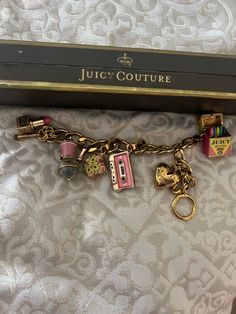 Handmade Charm Bracelet, Gold Charm Bracelet Aesthetic, Juicy Couture Charm Bracelet, Charm Bracelet Aesthetic, Charm Bracelet Diy, Juicy Couture Charms Bracelet, Pandora Bracelet Designs, Custom Charm Bracelet, Juicy Couture Bracelet