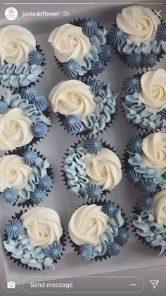 cupcakes with white and blue frosting in a box