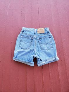 "Levi's 512 Women's vintage size 5 (much smaller as vintage sizes run small (26\" waist 32\" hips) slimmer fit Cut off by previous owner and hemmed nicely Washed out faded nice used condition 90's vintage high waist mom style jeans from the 90's 26\" waist more like a modern size 1/2 32\" hips 6\" inseam 9\" around thigh at opening (small thighs as well as small hips and waist) Rare find 1993 vintage" Cheap 90s Style Blue Jean Shorts, Vintage Denim Jean Shorts For Summer, Vintage Jean Shorts For Summer, Vintage Medium Wash Relaxed Fit Shorts, Vintage Denim Shorts In Medium Wash, Vintage High-waisted Medium Wash Jean Shorts, Vintage Medium Wash Denim Shorts, Vintage High-waisted Shorts Jeans In Medium Wash, Vintage High-waisted Jean Shorts For Spring