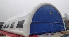 an inflatable tent is set up on the ground