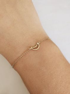 14K 9K Crescent Moon Bracelet, Half moon gold bracelet, Minimallist Dainty gold bracelet, Women Gift, Gift for Daughter, Birthday Gift, Gift for her, FREE EXPRESS SHIPPING Beautiful and delicate bracelet with a crescent moon charm made in 14K or 9K solid gold. Remember to reach for the moon and the stars, and they won't be able to resist flying into your hands! Whsiper...To the moon and back! -------------------------------------------------- D E T A I L S 14K Solid Gold or 9K Solid Gold Dimensi Gold Moon Charm Bracelet Jewelry, Adjustable Gold Bracelets With Moon Charm, Gold Moon Charm Bracelet, Adjustable Gold Moon Bracelets, Dainty Crescent Bracelet As Gift, Dainty Crescent Bracelet For Gift, Yellow Gold Bracelet With Moon Charm As Gift, Gold Moon-shaped Bracelets As Gift, Adjustable Crescent Gold Bracelets