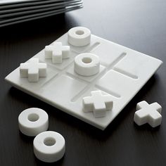 a close up of a board game on a table with dices and rings around it