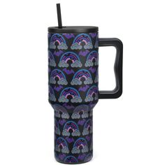 a black and purple travel mug with rainbows on it