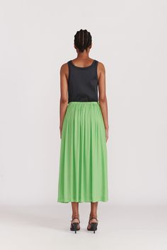 A Gathered ankle length skirt with elastic waistband in an excellent green silk. Hidden pockets and a full lining make this a no-brainer choice for adding this season's color to your palate. This color (Absinth) is also available in the Citron Organic Silk Dress. WHY WE LOVE IT INDRESS was founded in Paris in 2001 by Dutch designer Wies Schulte with the desire to combine elegance, timeless shapes and vibrant colors. Its collections are based on exclusive dyes and carefully selected fabrics, incl Green Flared Skirt With Elastic Waistband, Green Full Lined Maxi Skirt, Green Full Maxi Skirt With Lining, Green Voluminous Pleated Skirt, Green Flared Maxi Skirt Lined, Green Flared Maxi Skirt With Lining, Green Pleated Waist Summer Bottoms, Green Long Flowy Skirt, Green Summer Bottoms With Pleated Waist