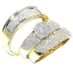 two gold rings with diamonds on them