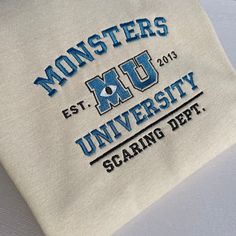 Monsters University embroidered design. (the year are not customisable) For mode designs ,please visit my shop. https://disneyembroiderygb.etsy.com Thank you! UNISEX HOODIE/SWEATSHIRT Fabric * 80% Cotton  * 20% Polyester Weight * 280 GSM - Soft cotton faced fabric. - Brushed back fleece. - Drop shoulder style. - Double fabric hood with self colour drawcord. - Front pouch pocket.(HOODIE ONLY) - Ribbed cuffs and hem. Monsters University Sweatshirt, Monsters Inc Merch, Cute School Merch, University Hoodie Design, Team Hoodie Design Ideas, Hoodie Design Embroidery, University Hoodie Outfit, Crew Neck Hoodie With Embroidered Logo For College, Custom Embroidered Crew Neck Hoodie For College