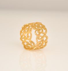 "This wide gold ring is a perfect wedding band for a woman. This lace gold ring is wide but delicate. It was designed by my middle daughter, she envisioned a gold ring with a strong presence but yet dainty and subtle in it's overall appearance. As a mother took special pride in creating this 14k gold band, I think the end result of a wide lace ring is wonderful and fulfills the purpose. I can set small Diamonds, Ruby, Sapphire or other gemstones, all around this band. * width: 10 m\"m * The ring Woman Wedding Band, Wide Gold Ring, Wide Wedding Rings, Wide Wedding Bands, Blue Opal Ring, Lace Ring, Lace Bands, Solid Gold Band, Etsy Gold Ring