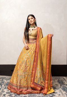 Yellow Color Swarovski Work Wedding Lehenga – Panache Haute Couture Reception Yellow Sharara With Intricate Embroidery, Semi-stitched Gold Anarkali Set With Motifs, Reception Yellow Embroidered Lehenga, Yellow Art Silk Embroidered Fabric For Reception, Gold Lehenga With Intricate Embroidery In Jamawar, Gold Jamawar Lehenga With Intricate Embroidery, Yellow Anarkali Set With Intricate Embroidery In Dola Silk, Traditional Yellow Anarkali Set With Dupatta, Yellow Dola Silk Anarkali Set With Intricate Embroidery