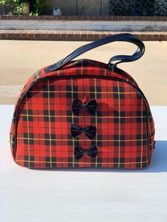 "The Brontë bowler in a splendid tartan plaid!  Get your Scottish on in this stunning tartan bowling bag perfect for day into evening!  This lassie was made to go places!  She will add the perfect British whimsy to your wardrobe and be the bag everyone asks you \"Where did you get that gorgeous bag!\"  Made from beautiful Scottish tartan wool and trimmed with boxed calf leather.  Velvet bows add detail and a feminine touch to this day into evening handbag.  As Merida says, \"Our fate lives withi Velvet Bows, Bowling Bag, Bowling Bags, Top Handle Bags, Evening Handbag, Scottish Tartans, Velvet Bow, Gorgeous Bags, Tartan Plaid