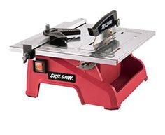 a table saw is sitting on top of a red stand