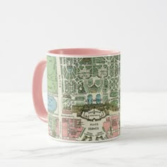 a pink and white coffee mug with a city map printed on the inside of it