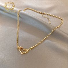 Introducing the epitome of romance and sophistication, behold the 18k Gold-Plated Heart Necklace, featuring a delicate outline of a heart pendant. This exquisite piece combines the luxurious allure of gold plating with the timeless symbolism of the heart, creating a stunning expression of love and devotion. The minimalist design of the pendant allows for effortless styling, making it the perfect complement to both casual and formal attire. Whether worn as a symbol of romantic love or as a meaningful reminder of self-love and empowerment, this necklace is sure to captivate hearts and inspire admiration wherever you go. Gold-tone Gold Plated Heart Necklace, Gold-tone Gold-plated Heart Necklace, Gold-tone Heart Necklace With Delicate Chain, Delicate Gold Heart Pendant Necklace, Gold Double Heart Necklace With Delicate Chain, Elegant Gold-tone Heart Charm Necklace, Elegant Gold Heart Necklace With Adjustable Chain, Elegant Gold-tone Heart Pendant Necklace, Luxury Gold Heart Necklace Gift