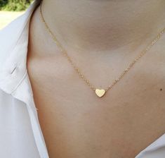 One cannot go wrong with classics such as a delicate heart pendant. This necklace is the epitome of timeless romantic elegance. Perfect gift for Valentine's day. Ideal as a bridesmaid gift, girlfriend gift, best friend gift, mother's day gift, birthday gift, or any other special occasion. one small stainless steel heart is suspended on a 16 in long with 2 in extender chain (total 18 in long) stainless steel chain. hearts are really tiny and delicate - hearts are 0.5cm stainless steel and double Minimalist Heart-shaped Necklace For Birthday Gift, Dainty Heart-shaped Necklaces As Gifts For Her, Dainty Heart-shaped Necklace For Gift, Gold-tone Heart-shaped Delicate Chain Necklace, Dainty Heart-shaped Metal Chain Necklace, Valentine Gifts For Girlfriend, Sweet Necklace, Love Girlfriend, Silver Heart Pendant