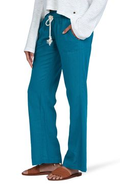 Nautical inspiration shows in the narrow rope drawstring cinching the waist of gauzy cover-up pants that make the drive home from the beach a little better. Style Name:Roxy Oceanside Linen Blend Beach Pants. Style Number: 636122.