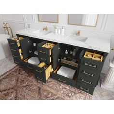 a bathroom vanity with two sinks and three drawers in the same color as well as an area rug