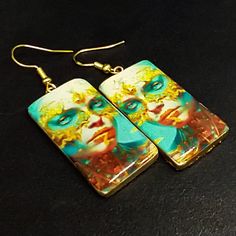 These image transfer earrings are ready to ship.  The earrings are handcrafted from polymer clay and uses my own image transfer technique. They have a top layer of resin.  I have only one pair of these earrings. Artistic Hand Painted Earrings For Gifts, Hand Painted Yellow Artsy Earrings, Yellow Hand Painted Artsy Earrings, Artsy White Resin Earrings, Artistic Hand Painted Yellow Earrings, Artistic Resin Earrings For Pierced Ears, Artsy Polymer Clay Drop Earrings, Artistic Hand Painted Polymer Clay Earrings, Artistic White Resin Earrings