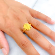 This exquisite 22k gold ring, weighing 3.6 grams, features a stylish and brilliant design that exudes elegance and charm. The yellow gold finish enhances its radiant appeal, making it perfect for any occasion. The ring is available in size 7.5, with sizing options available to ensure a perfect fit. Ideal for those who appreciate high-quality craftsmanship and timeless beauty, this brilliant Turkish gold ring is a cherished addition to any jewelry collection. Product Details Gold Purity(karat): 2 Elegant Yellow Hallmarked Signet Ring, Yellow 22k Gold Rings, 22k Yellow Gold Engraved Ring, Hallmarked 22k Yellow Gold Signet Ring, 22k Gold Yellow Ring Gift, 22k Gold Yellow Ring As A Gift, Gift 22k Gold Yellow Ring, Gift Yellow 22k Gold Ring, 22k Gold Ring