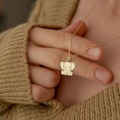 "* Material: High Quality 14K Solid Gold - Not Gold Vermeil Not Gold Plated - ( REAL SOLID GOLD ) * Metal Stamp: 14k * All our jewelry is custom made by hand with Love and Care in our workshop * 14k Solid Gold Elephant Necklace - Tiny Baby Elephant Pendant - Dainty Animal Necklace - Elephant Jewelry - Gift For Her - By Demir Uluer H O W ∙ T O ∙ O R D E R * You can choose the color of your pendant using the first box / option * You can choose the length of your chain by selecting the second option / box. * Just use the 'PERSONALIZATION BOX' to let us know the Note you want on the back of your Pendant O T H E R ∙ I N F O R M A T I O N * Material of chain: 14K Solid gold ( REAL GOLD ) It is thin and dainty and it is available in 6 sizes: - 35 cm / 13,75 inches ( Length ) - 40 cm / 15,75 inche Handmade Pendant Charm Necklaces For Birthdays, Handmade Pendant Charm Necklaces For Birthday, Handmade Pendant Charm Necklace For Birthday, Handmade Yellow Gold Necklace For Personalized Gift, Cute Handmade Jewelry For Personalized Gifts, Cute Handmade Gold Necklaces, Cute Handmade Necklaces For Personalized Gifts, Gold Animal Design Necklace For Gift, Gold Necklace With Animal Design For Gift