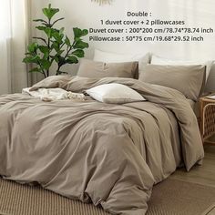 an image of a bed that is made up with comforter and pillows on it