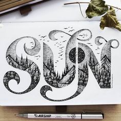 an ink drawing of the letter s on paper