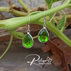 Peridot Earrings, 925 Sterling Silver Earrings, August Birthstone, Peridot Teardrop Earrings, Green Drop & Dangle Earrings, Peridot Jewelry Handmade Item :- =>Materials : Silver, Stone =>Gem Stone : Peridot =>Gem Color : Green =>Gem Size : 10*12mm =>Band Color : Silver =>Silver Polish : High Polish Peridot is a mineral of the olivine family. It has a color that is entirely its own, but it is many a times confused with Emerald stone. The green color of a Peridot ranges from pale green to bottle g Green Sterling Silver Teardrop Earrings Hypoallergenic, Green Sterling Silver Teardrop Earrings, Green Sterling Silver Teardrop Earrings Gift, Green Sterling Silver Teardrop Dangle Earrings, Green Sterling Silver Teardrop Earrings For Formal Occasions, Formal Green Teardrop Sterling Silver Earrings, Formal Green Sterling Silver Teardrop Earrings, Green Gem, Handmade Jewelry Box