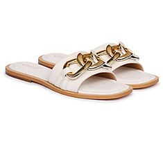 Perfect for your next summer outing, this open-toe sandal boasts a wide front strap accented with a metallic chain trim. From Saint G. Off White Slides, White Slides, Fashion Shoes Sandals, Biker Boots, White Flats, Gold Logo, Tory Burch Miller Sandal, Ballerina Flats, Open Toe Sandals