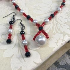 ~Item Info~ Red necklace / red bead necklace: what a statement this stunning red, white and black bead necklace and earring set makes! And it could make a special birthday gift for mom, wife or sister, a gift for her. ~Measurements~ Necklace is approximately 20.5 inches long Earrings are approximately 2.5 inches long ~Want to see more of Jay's extraordinary bead necklace and earring sets?~ https://www.etsy.com/shop/DragonflyDenim?ref=hdr_shop_menu&section_id=16638069 . ~Packaging~ Our jewelry is packaged in a free cardboard box, then it's bubble wrapped and sent in a dragonfly decorated envelope. ~Shipping~ Free shipping in USA. We ship all paid orders within 2 business days by USPS first class and will convo you the tracking number.  ~Safety Info~ Intended for adult use only. Small parts Red Dangle Necklaces For Party, Red Beaded Christmas Jewelry, Elegant Red Beaded Necklace For Christmas, Red Beaded Necklace For Valentine's Day Gift, Red Beaded Jewelry For Valentine's Day, White Beaded Necklace For Valentine's Day Gift, Elegant Red Necklace For Christmas, Elegant Red Christmas Necklace, Red Dangle Beaded Necklaces As Gift