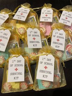 the school survival kit is packed in plastic bags and tied with yellow ribbon on top